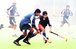 Players from Patiala and Sudhar during a Punjab Hockey League match (u-14) on the PAU campus in Ludhiana on Sunday. 