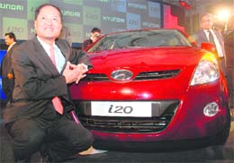 H. S. Lheem, managing director of Hyundai Motors India Limited (HMIL), poses with i20 car at its launch in New Delhi on Monday.