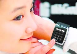 This handout photo released on Monday by LG Electronics shows its new watch-shaped mobile video phone "3G watch phone" model. It has a touch-screen dialling system with a camera and a speaker built in to enable users to make video calls with high-speed downlink packet access.