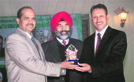 Asian Golf champion Jeev Milkha Singh (right) being honoured by Chandigarh Golf Associaton president CSR Reddy on Monday.