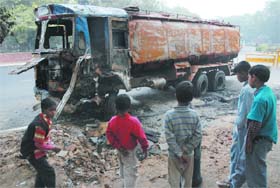 The burnt petrol tanker at the Outer Circle of the India Gate in New Delhi