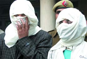 Two Afghans caught by the Lajpat Nagar police for posessing fake visas and consulate stamps in New Delhi