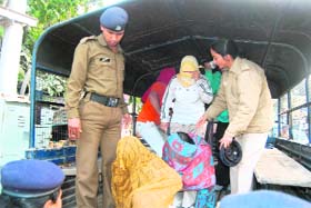 Police personnel escort four boys and six girls, who were yesterday arrested on charges of immoral trafficking, to a local court in Dehradun
