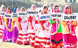 Players from different states participate in a march past at the concluding function of the four-day national women sports festival at Hamirpur