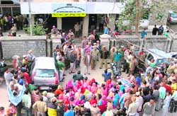 Farmers hold protest outside the office of the SDM against the setting up of a cement plant at Sundernagar