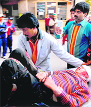 Paramedical staff shift pilgrims injured in a landslide near Vaishno Devi to Government College and Hospital in Jammu on Monday.