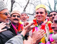 National Conference president Omar Abdullah is garlanded by supporters in Srinagar on Monday after his victory from Ganderbal