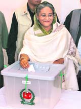 Former Bangladesh PM and president of the Awami League Sheikh Hasina casts her vote in Dhaka on Monday. 