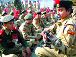 Girl cadets get rifle training at the annual NCC camp at Government Senior Secondary School in Amritsar