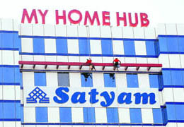 Labourers clean the Satyam building in Hyderabad on Tuesday.