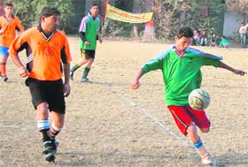 Players in action at the Kharag Bahadur Memorial Football Tournament at Nehrugram, Dehradun