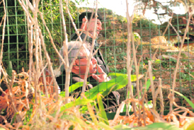 A man smokes sitting right behind the stage where senior BJP leaders, including LK Advani and Chief Minister Prem Kumar Dhumal, were addressing a rally in Shimla on Tuesday.