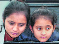A Pakistani girl and her mother head home after being released by India on Tuesday.