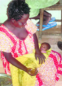 An Onge tribe woman along with her newborn baby at GB Pant hospital in Port Blair on Tuesday.