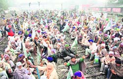 Farmers stage a dharna on railway tracks in Bathinda on Tuesday.