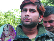 Naveen, held for killing a woman bartender (inset), in New Delhi on Wednesday.
