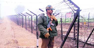 A BSF jawan guards the border at Wagah