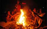 A Rajasthani family lights a bonfire to beat the cold at Gurgaon 