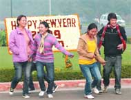 Visitors greet each other Happy New Year at the flower-bedecked Vijay Chowk in New Delhi