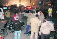 Policemen check vehicles at Dila Ram Chowk on the New Year Eve in Dehradun