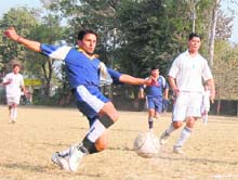 Players in action during the first semifinal of the Kharag Bahadur Memorial Football Tournament in Dehradun on Thursday. 