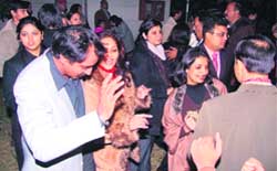 People dance at a New Years Eve party in Palam Vihar, Gurgaon