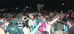 People celebrate New Year at the Ridge in Shimla on Wednesday.
