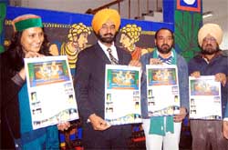 Kahan Singh Pannu (centre) releases the New Year calendar at Virsa Vihar Sadan in Amritsar
