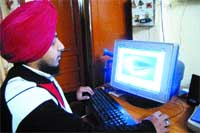 Manu shows a computer graphic at his residence in Amritsar