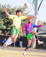 Eleven Star player heads the ball at the 2nd semifinal match of Kharag Bahadur Memorial Football Tournament in Dehradun on Friday. 