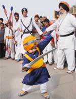 A child caught the attention of many during a procession carried out ahead of the birth anniversary of Guru Gobind Singh in Bathinda