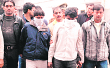 Suspects Naseem and Ansari in the custody of the police in Gurgaon on Saturday.