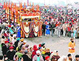 Members of the Sikh community take part in a religious procession during the celebrations of Parkash utsav in Jammu on Saturday