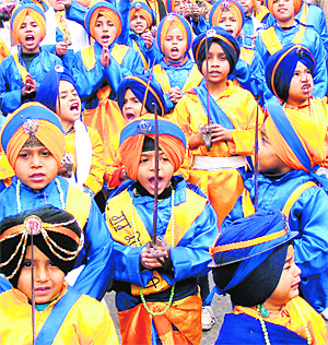 Kids dressed as warriors during a nagar kirtan; and (right) an elephant leads the procession in Ludhiana on Saturday.
