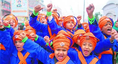 Students of Harkrishan Public School participate in a nagar kirtan ahead of the birth anniversary of Guru Gobind Singh in Amritsar