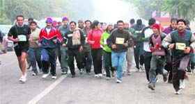 People participate in a 5-km run in Sector 55, Gurgaon