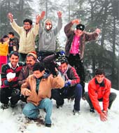 Tourists frolic after a heavy snowfall at Patnitop