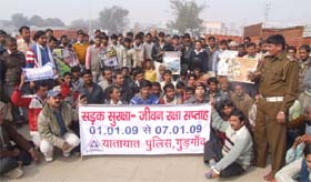 FOLLOW ROAD RULES: A traffic policeman teaches traffic rules to truck drivers during the Road Safety Week in Gurgaon