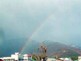 A view of rainbow over Dhauladhar mountains.