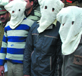 The Kalkaji robbers in police custody in New Delhi on Tuesday.