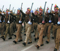 A Delhi police marching contingent passes through the Rajpath during the rehearsal for the Republic Day parade in New Delhi on Tuesday.