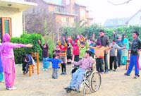 Special children exercise at the Life Help Centre for Childcare in Srinagar.