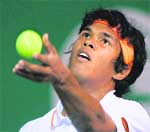 Indias Somdev Devvarman plays a return against US Kevin Kim during their first round match