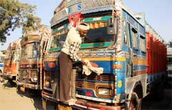 On the third day of the truck operators nationwide strike, a trucker cleans up his truck on the premises of the Truck Operators Unions office in Bathinda