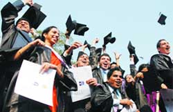 Doctors lift their hats as they pose for a photo at the 36th convocation of the All-India Institute of Medical Sciences in New Delhi