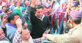 Non-teaching staff stage a protest at the Secretariat in Dehradun on Wednesday.