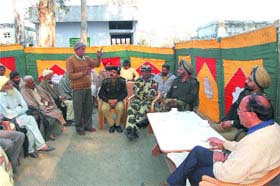 BSF officers listen to the grievances of residents of Bharial village in Gurdaspur district