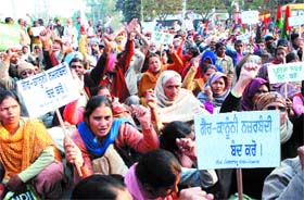 Members of the Lok Sangram Manch, Punjab, stage a dharna in front of the deputy commissioner office in Jalandhar