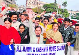 Members of the All-Jammu and Kashmir Home Guards Welfare Association protest in support of their demands in Jammu on Wednesday.