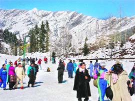 A festive atmosphere prevailed at Solang, 13 km from Manali, as revellers flocked to the valley to enjoy in fresh snow.